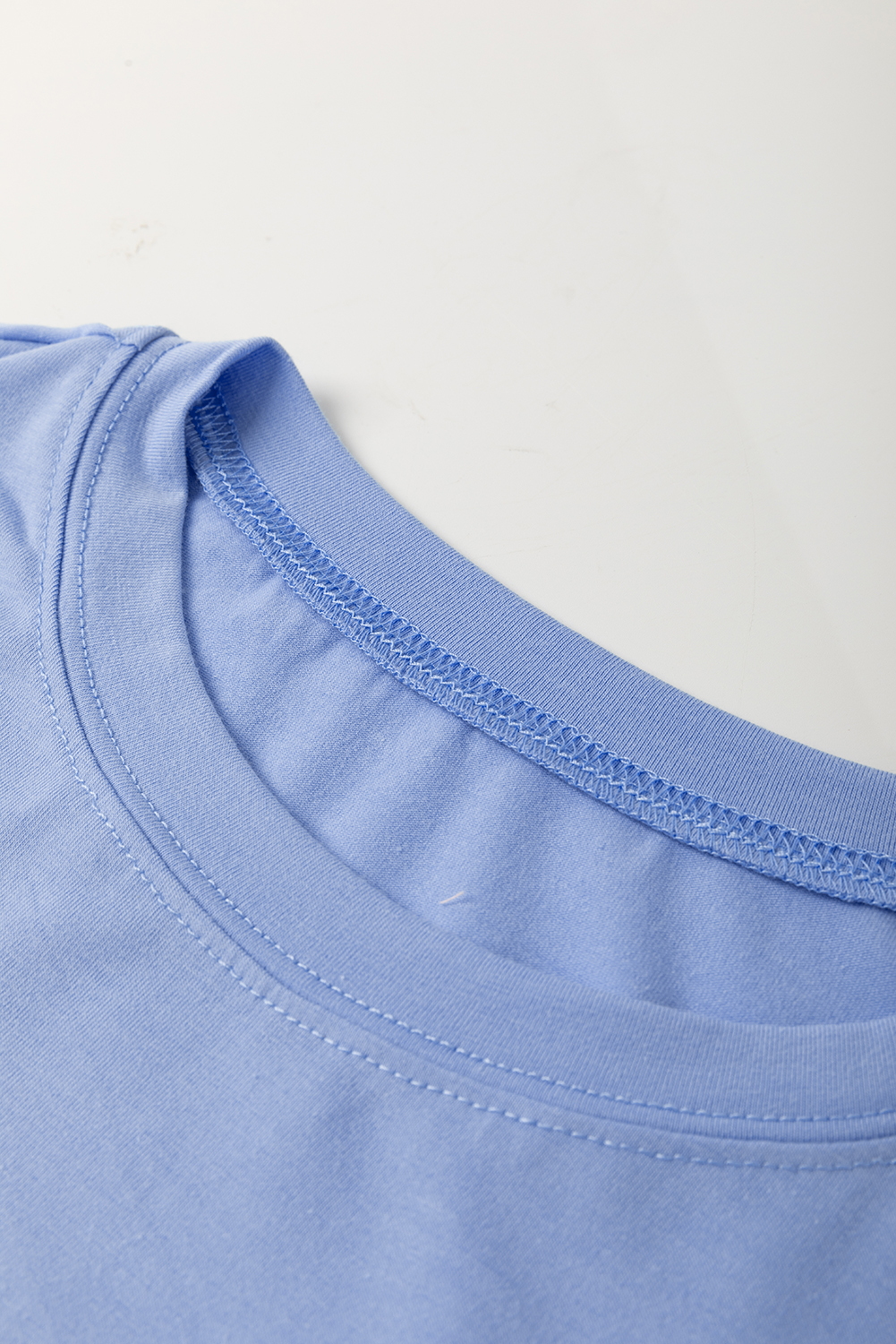Casual Summer T-Shirt: Unique Floral Patch Design and Modern Exposed Stitching - Detail View 6