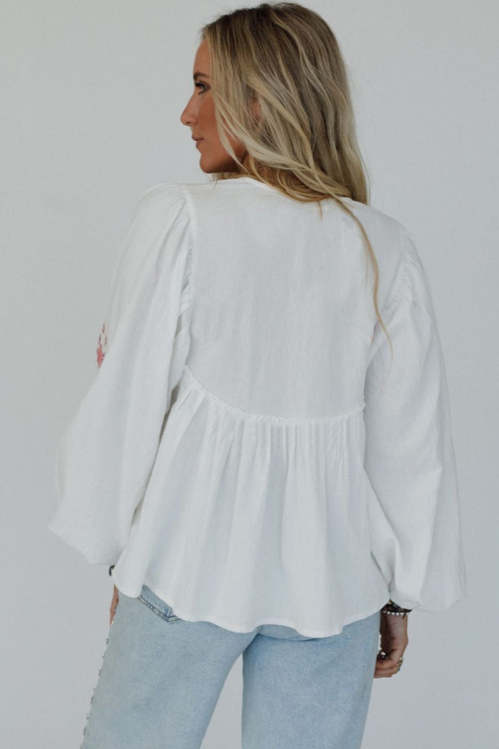 Chic Floral Embroidered Babydoll Top - Flowy Fit with Tassel Detail - Detail View 2