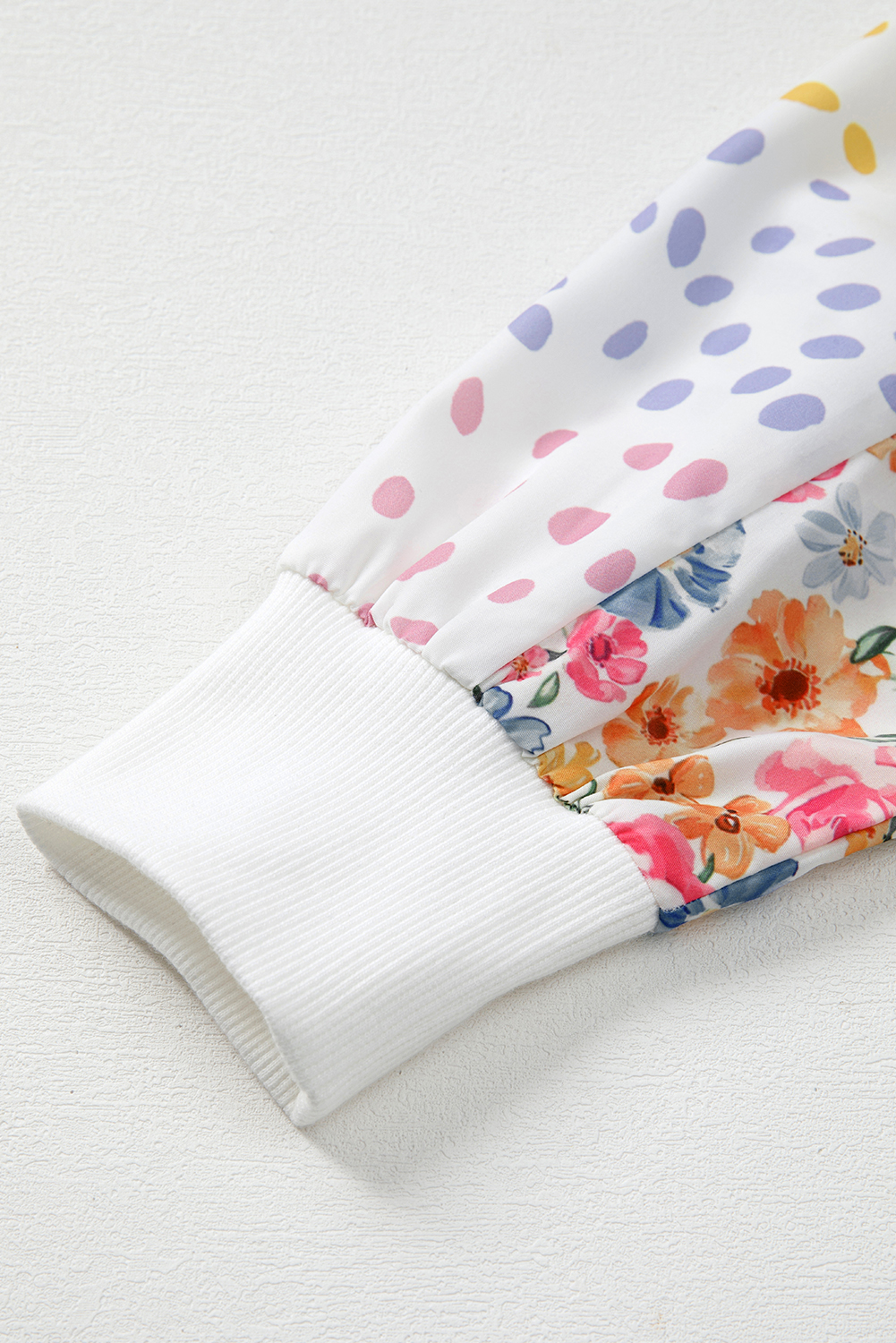 Trendy High Low Sweatshirt with Floral Dotted Patchwork Sleeves for a Chic Look - Detail View 10