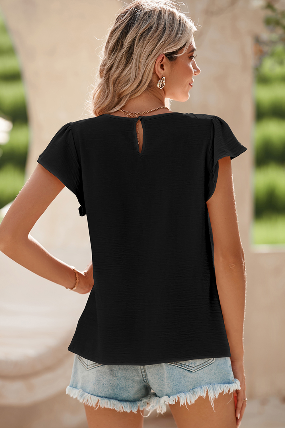 Chic and Modern Black Blouse with Flounce Sleeves and Pleated Detail - Detail View 6
